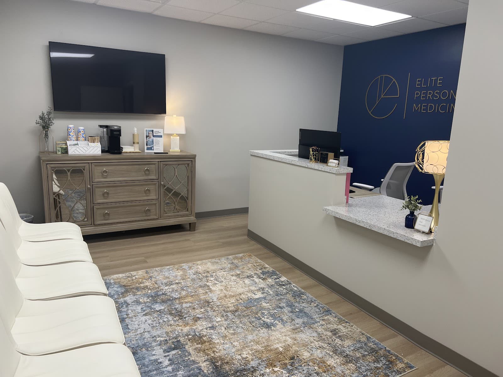 Front desk and waiting area at the Elite Personalized Medicine office in Dacula, GA