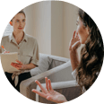 A woman talking with her functional medicine health coach